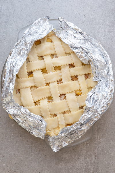 Wrapping the pastry edges with foil.