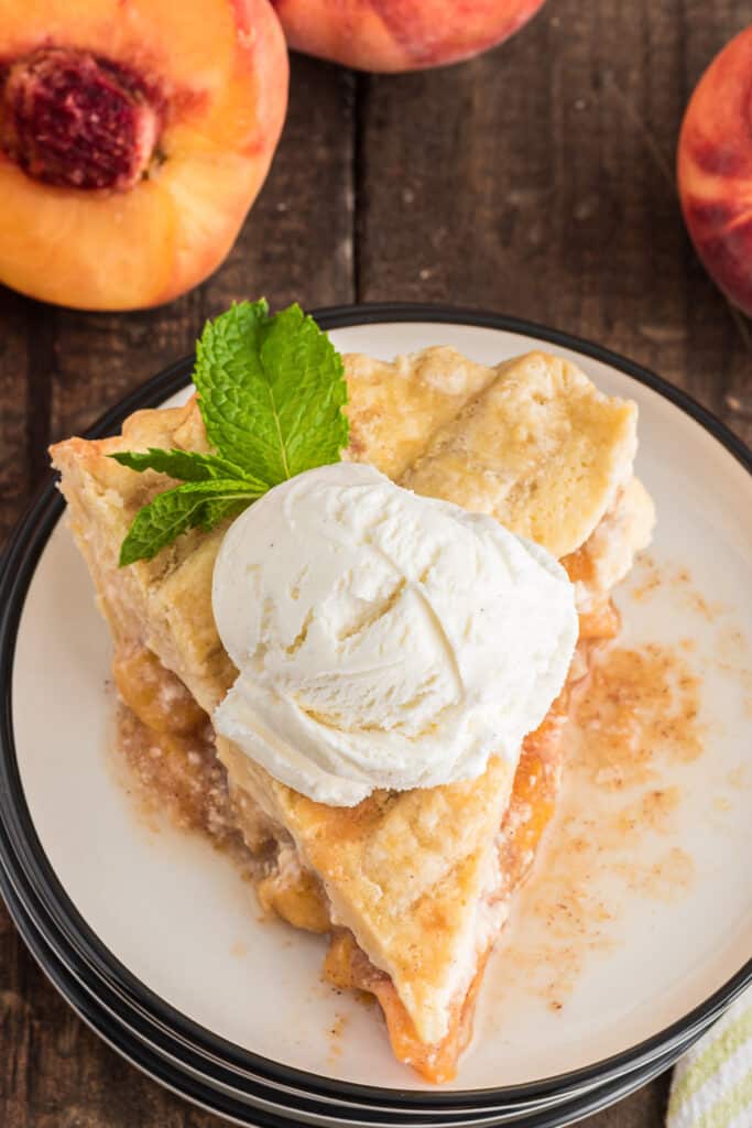 A slice of pie on a white plate.