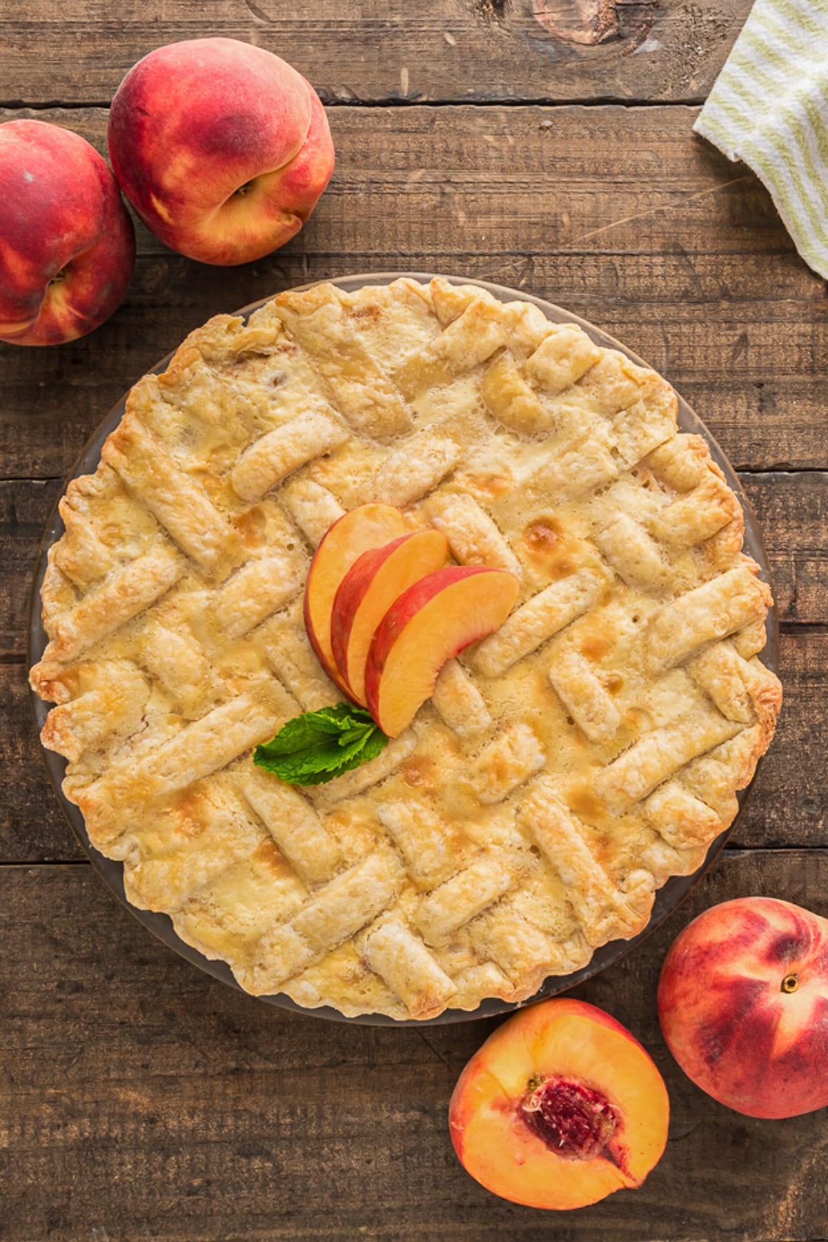 Peach pie on a wooden board.