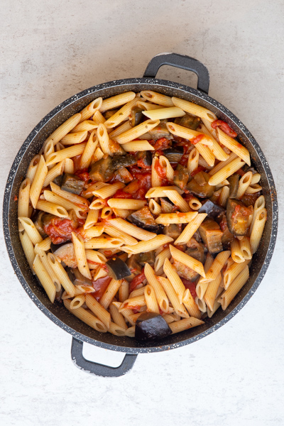 Pasta & water added to the pan with the tomatoes & eggplant.