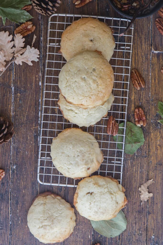 Pecan cookies on a wire rack.