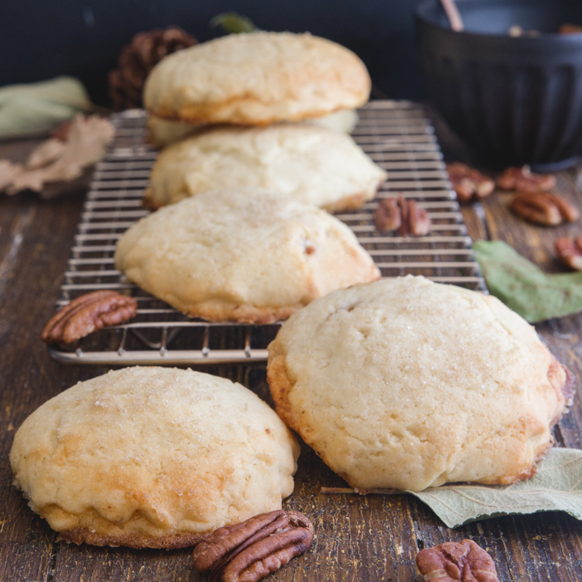 Pecan cookies on a wire rack.