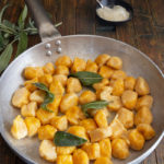gnocchi in a silver pan with sage.