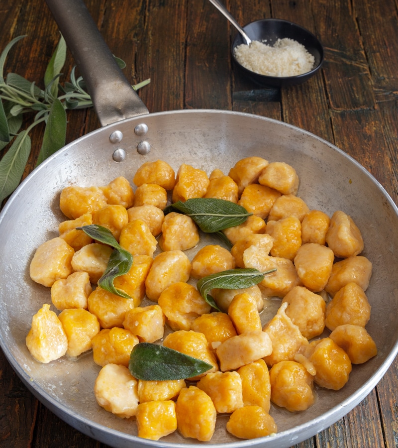 gnocchi in a silver pan with sage.