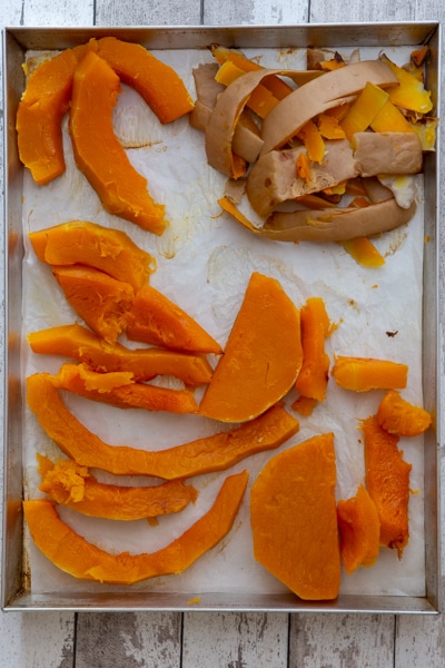 Cooked squash on the cookie sheet with the peel removed.