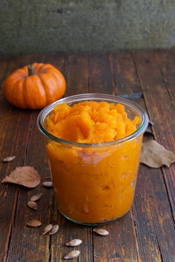 Ricer pureed pumpkin in a glass jar.