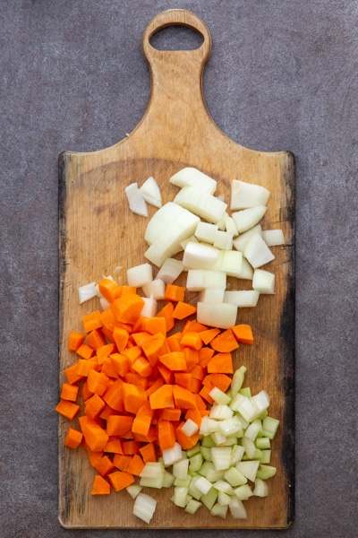 Vegetables chopped on a wooden board.