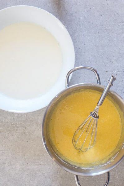 Milk & cream heated and egg & sugar in a medium silver pot.