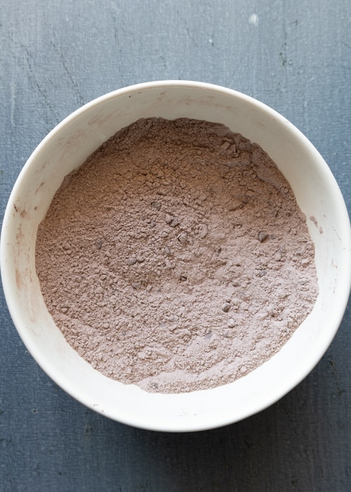 The dry ingredients whisked in a white bowl.