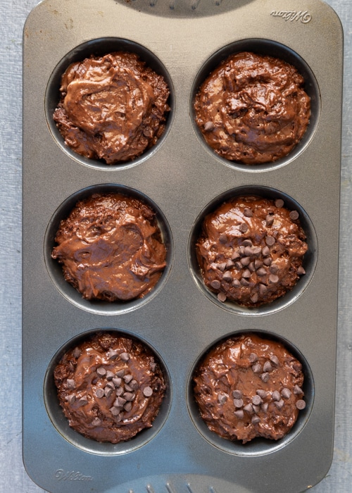 The muffins in the tin before baking.