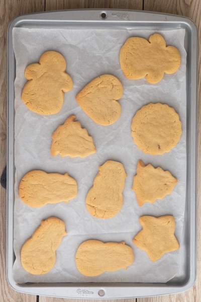 Peanut butter cookies baked on a cookie sheet.