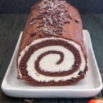 Swiss Roll cake on a white plate.