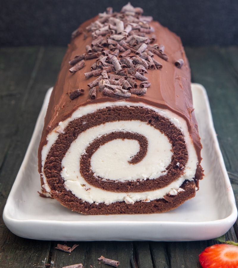 Swiss Roll cake on a white plate.