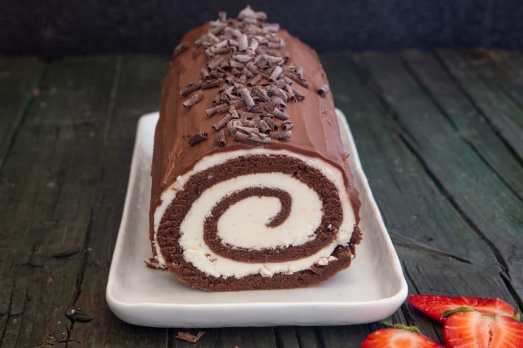Roll cake on a white plate.