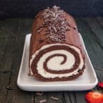 Swiss Roll cake on a white plate.