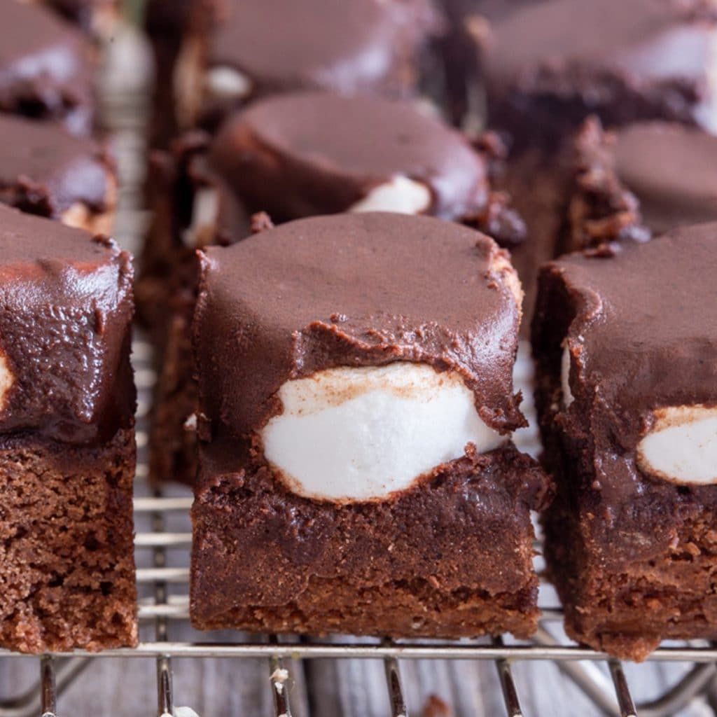 Fudgy brownies on a wire rack.