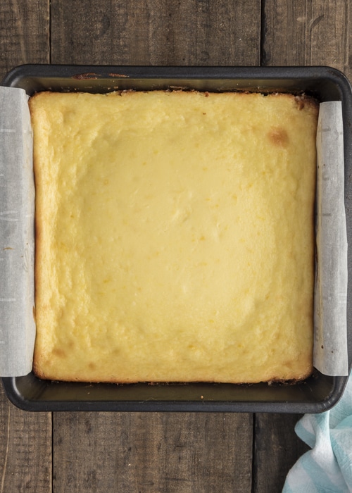 The cheesecake bars after baked in the pan.