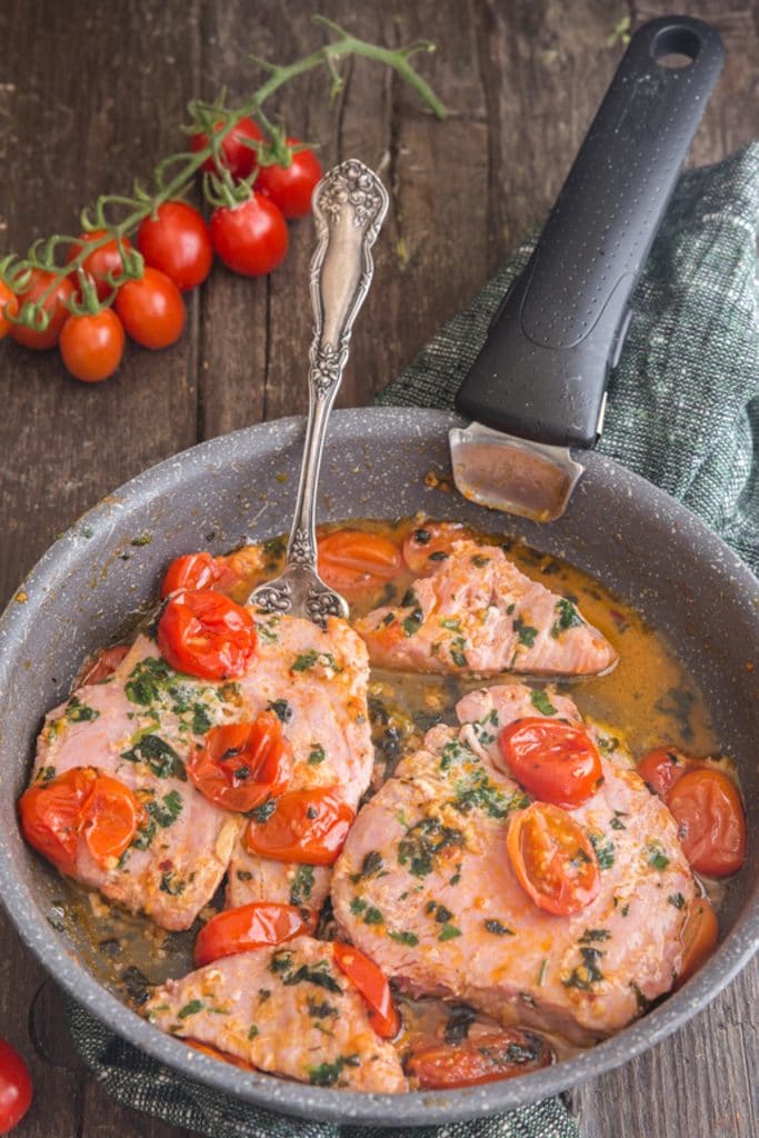 Tuna steaks in a pan.