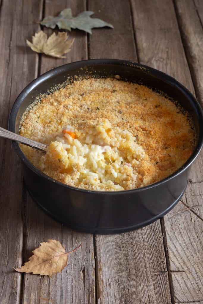 Rice casserole with a spoonful.