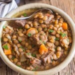 Soup in a bowl with a spoon.