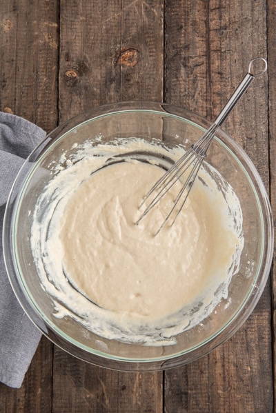 The batter mixed in a glass bowl.