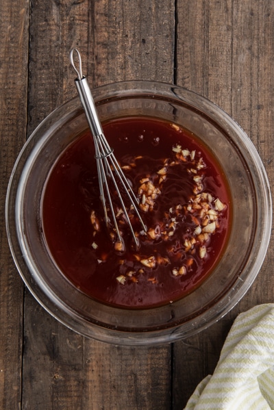 The bbq sauce in a glass bowl.