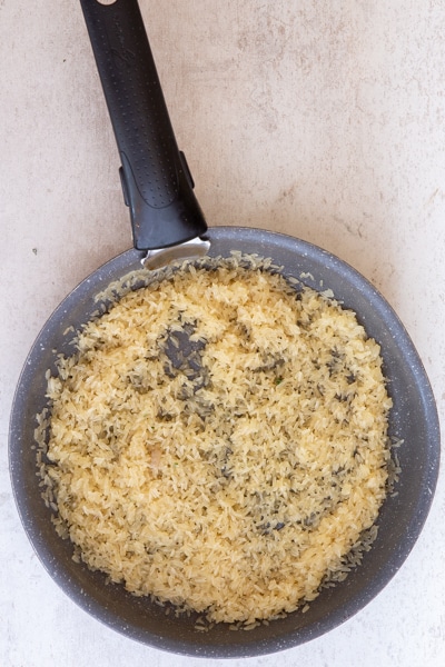 Cooking the rice in the pan.