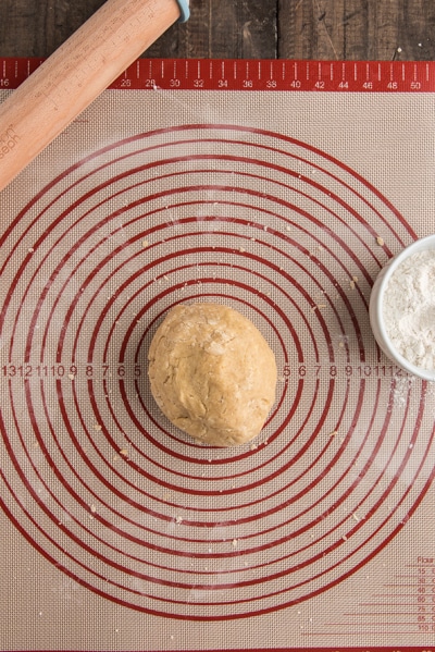The welsh cake dough on a baking mat.