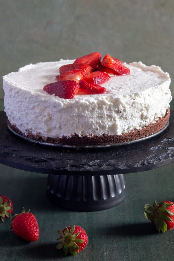 Ricotta cheesecake with strawberries on top.