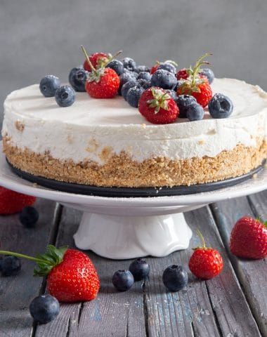 Greek yogurt pie on a white cake stand.