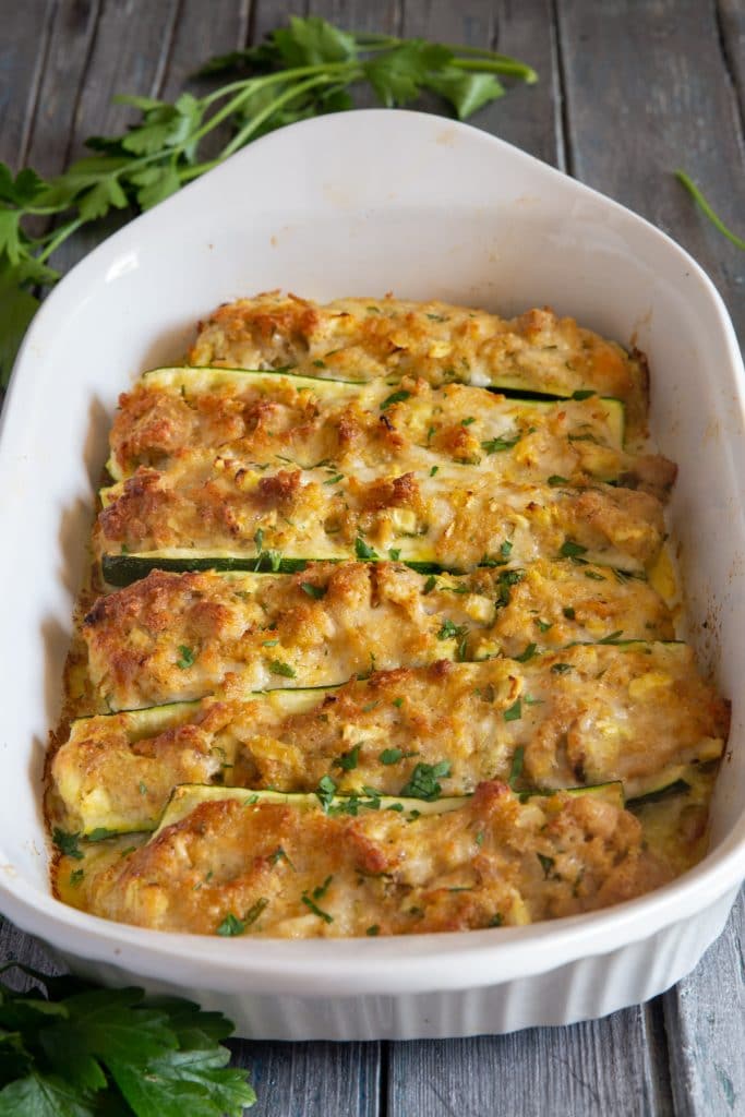 Baked zucchini in a white pan.