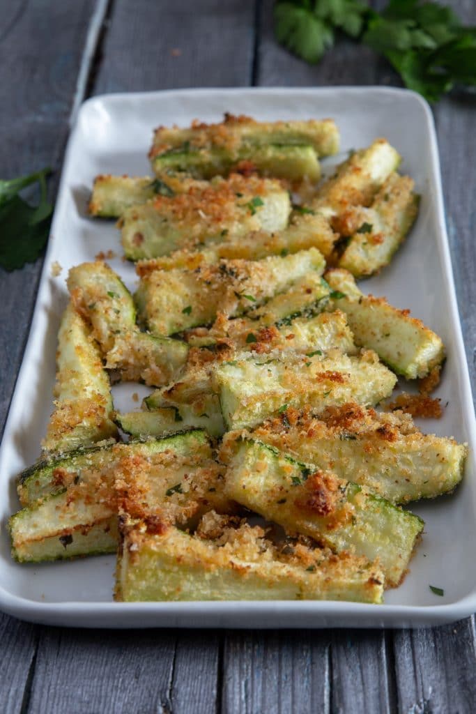 Baked zucchini on a white plate.