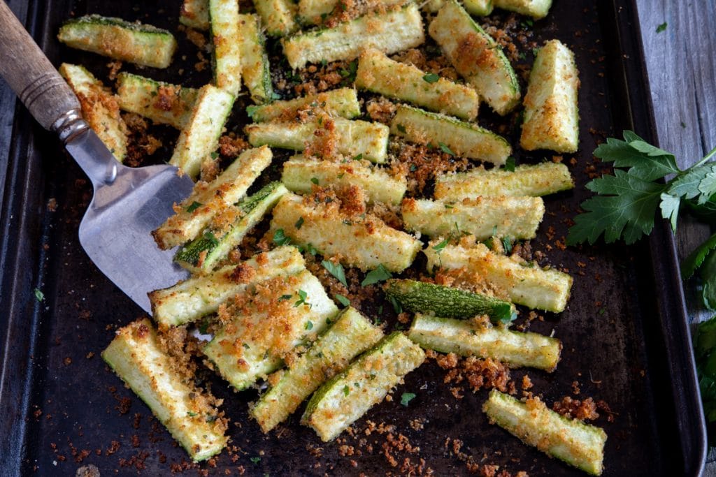 Zucchini on a cookie sheet.