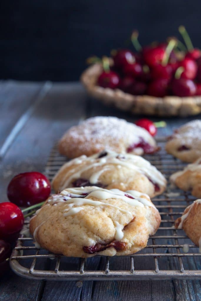 Cherry cookies on a wire rack.