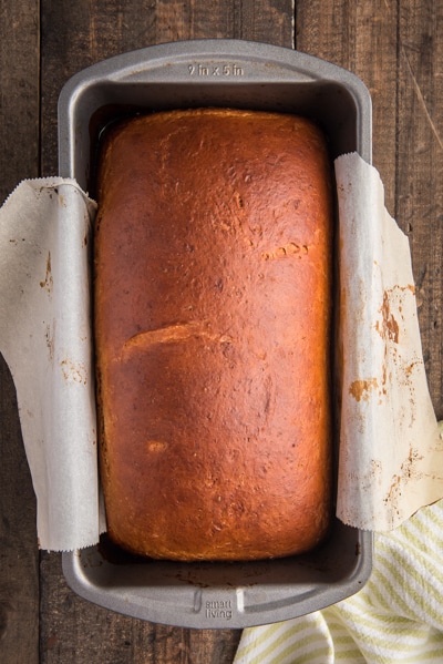 The baked peach bread in the loaf pan.
