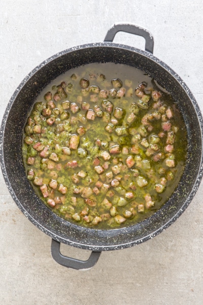 Pancetta and pets cooked in the pan.