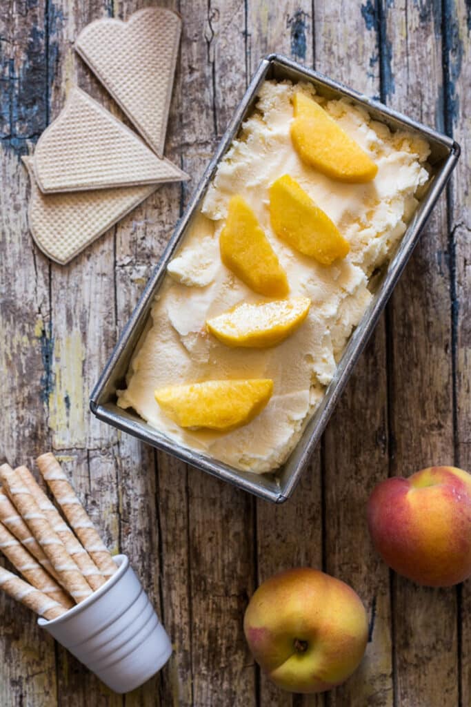 Peach ice cream in a loaf pan.