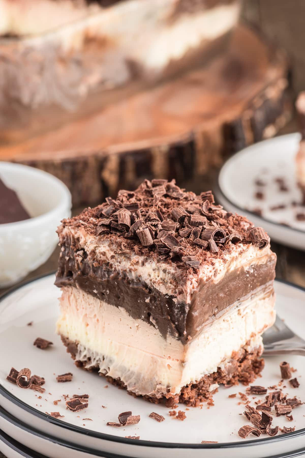 A slice of chocolate lasagna on a white plate.