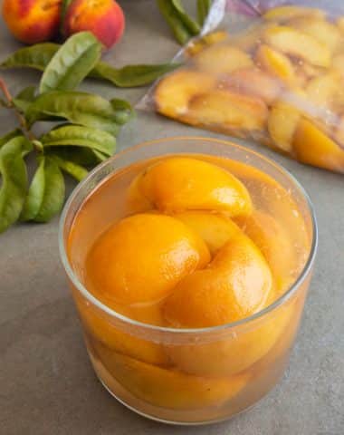 Preserved peaches in a glass jar and in a re sealable bag.