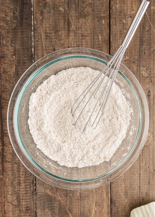 The flour whisked in a glass bowl.