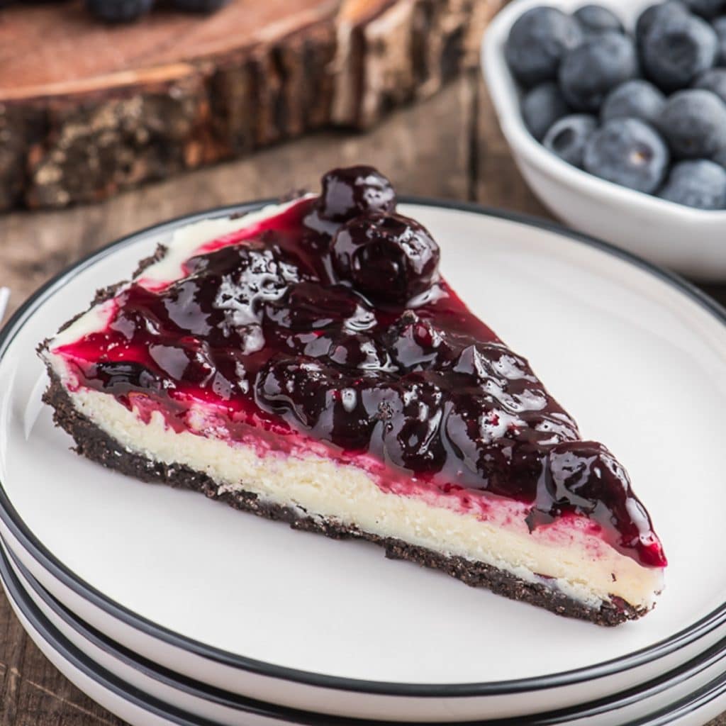 A slice of pie on a white plate.