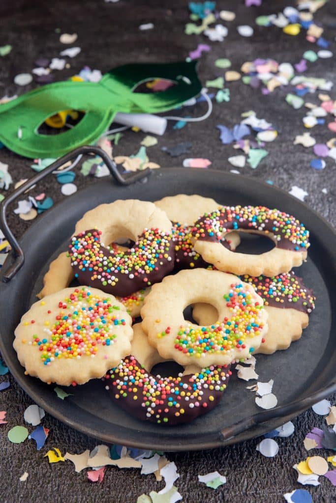 Carnival cookies on a black plate.