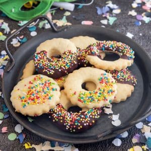 Carnival cookies on a black plate.
