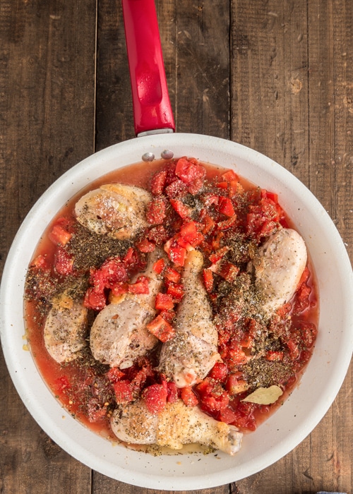 All the ingredients in the pan to make chicken cacciatore.