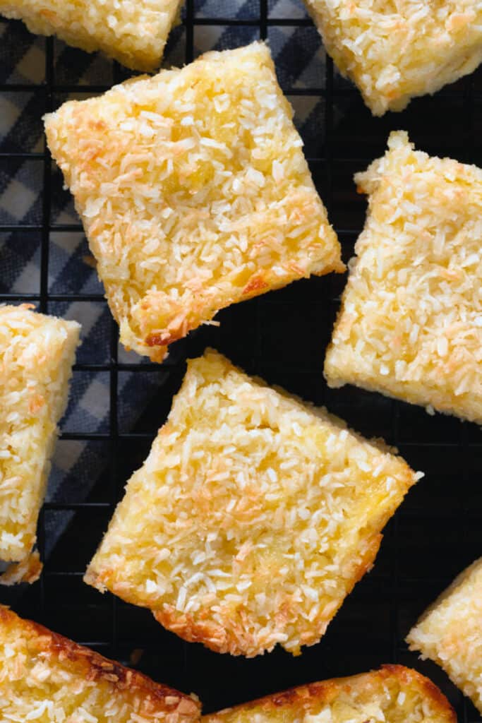 Coconut bars on a black board.