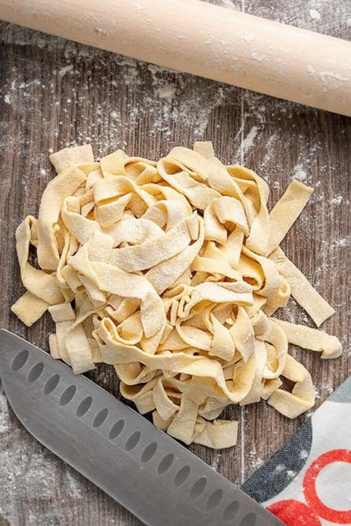 Fresh pasta on a wooden board.