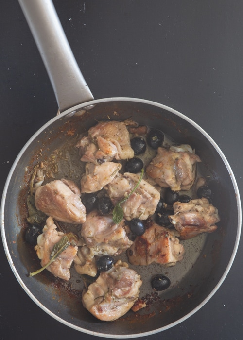 Chicken is ready in the pan with the olives.