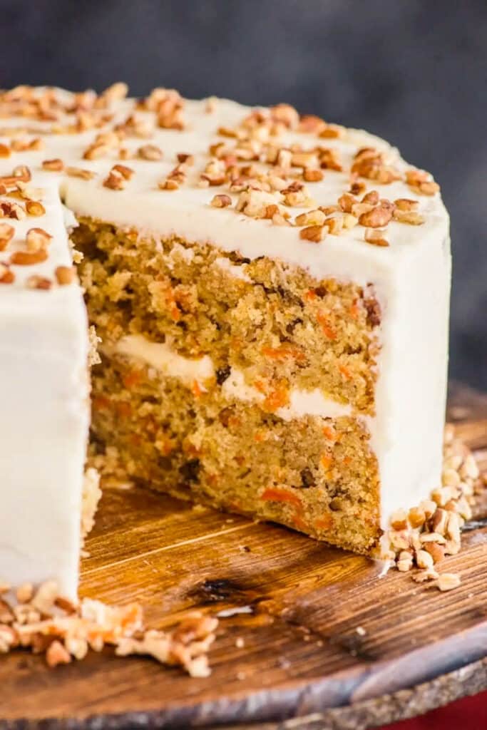 Carrot cake with a slice cut.