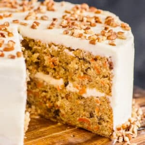 Carrot cake with a slice cut.