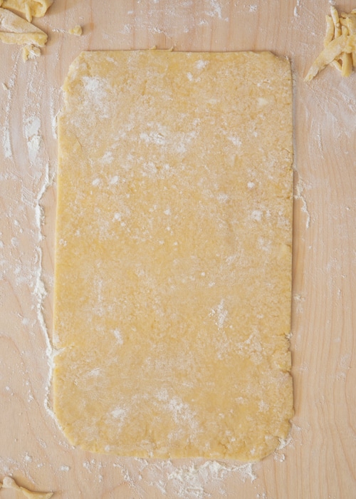 The cookie dough rolled into a rectangle and cut in half.